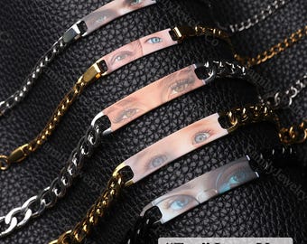 May include: A collection of waterproof bracelets with chain links. Each bracelet features a rectangular plate with a close-up image of an eye. The text "Eye Love You" is visible.