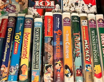 Disney VHS movies- in cases  Winnie the Pooh, Tarzan, Pinocchio, grand adventures with Winnie the Pooh, Pocahontas, Treasure Island, Mickey