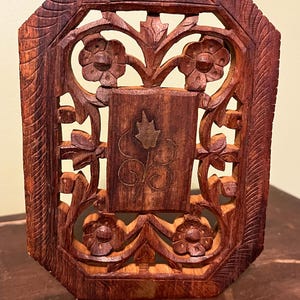 Carved wood trivet with brass inlay made in India