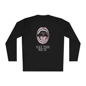May include: Black long-sleeve shirt with a pink graphic of a mouth with teeth and the text "EAT THE RICH" in white.