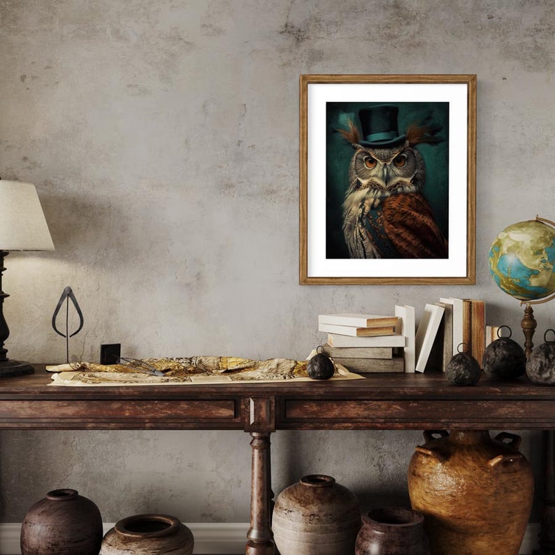 May include: A framed print of an owl wearing a blue top hat with a brown and white patterned body against a teal background.