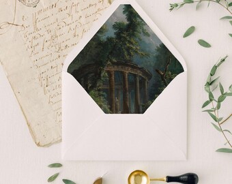 May include: A white envelope with a landscape painting of a classical ruin inside. The scene is surrounded by greenery. Also included are a vintage letter, wax seals, a wax stamp, a gold spoon, and a white flower.