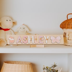 Personalisiertes Namenspuzzle mit Zapfen, Baby erste Weihnachtsgeschenke, Holzspielzeug, Babypartygeschenk für Kinder, kundenspezifisches hölzernes Namenspuzzle