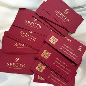 Burgundy business cards with gold paint