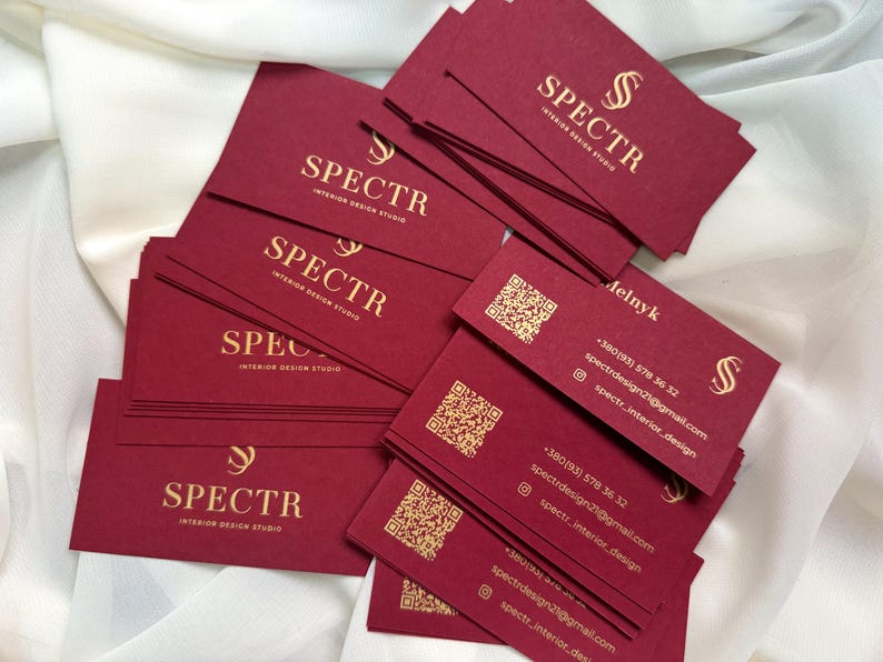 Burgundy business cards with gold paint