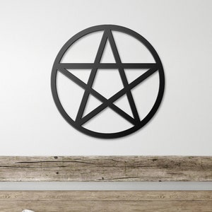 May include: A black metal pentagram wall decor in a circular frame, hanging above a wooden bed with white bedding and a wooden bench. Two wicker baskets are on the floor in front of the bed.