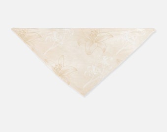 May include: A light beige bandana with a floral pattern of lilies in a light brown colour.