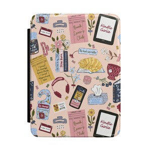 May include: A light pink e-reader case featuring a repeating pattern of books, library cards, a sleeping orange cat, flowers, headphones, a tissue box, and e-readers with the text Kindle Girlie, Book Lover's Club, and Go Away I'm reading.
