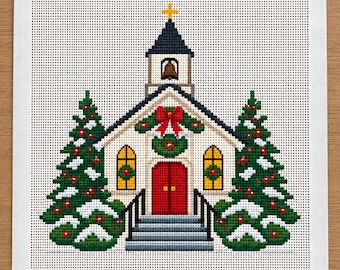 May include: A cross-stitch pattern on white fabric featuring a church with a red door, a bell tower with a yellow cross, and two snow-covered pine trees decorated with red berries. The church is adorned with a green wreath and a red bow.