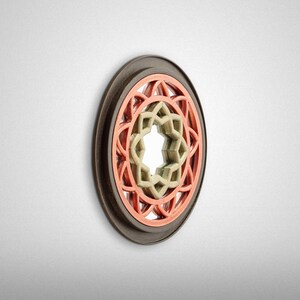 May include: A circular wall decor with a wooden frame and a multi-layered design. The center of the design is a star shape with a mirror-like surface. The star is surrounded by two layers of intricate geometric patterns in shades of red and green.