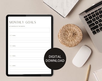May include: A digital download for a monthly goals planner. The planner has a white background with black text and a gray border. The text says "MONTHLY GOALS" and "MY MANTRA OF THE MONTH". There are four sections for goals with checkboxes and lines for writing.