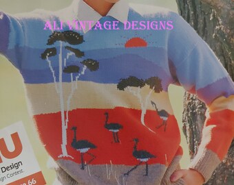 May include: A woman wearing a multi-colored knitted sweater with a design of trees and birds. The sweater has a brown, beige, yellow, orange, and blue color scheme. The text "Ali Vintage Designs" is visible on the sweater.