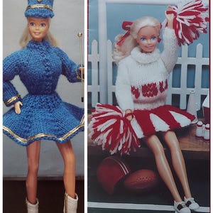 May include: Two knitted doll outfits, one a blue and gold marching band uniform with a hat, and the other a white and red cheerleader outfit with pom-poms.