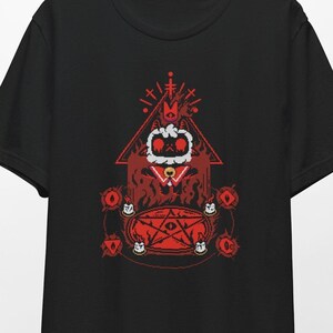 May include: Black t-shirt with a red graphic of a cartoon character wearing a crown and a pentagram. The character is surrounded by a red pentagram and red eyes.