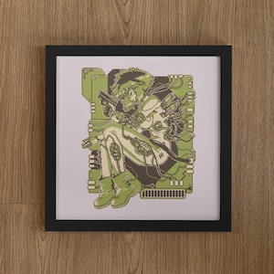 May include: A framed cross-stitch artwork featuring a pixelated illustration of a cyborg figure with short hair, holding a handgun, and connected to green circuit board patterns. The design uses shades of olive green, cream, and dark brown.