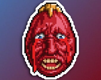 May include: A pixelated sticker of a red, crying face with a yellow mohawk. The face is contorted in a grimace, with wide eyes and a gaping mouth.
