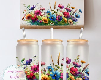May include: Three frosted glass tumblers with a floral design. Each tumbler has a bamboo lid and a clear reusable straw. The floral design features a variety of colorful flowers, including pink, purple, blue, yellow, and white.