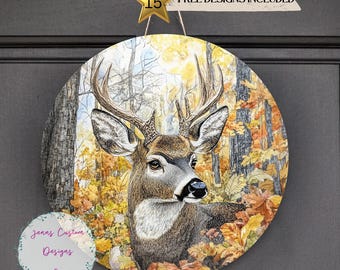 May include: A round wooden door hanger with a detailed illustration of a white-tailed deer in an autumn forest setting. The deer is looking directly at the viewer with its antlers visible. The background features a variety of fall foliage in shades of orange, yellow, and brown.