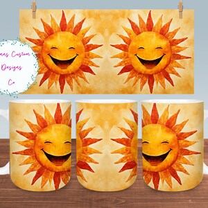 May include: A white ceramic mug with a design of a smiling sun with orange and red rays on a yellow background.