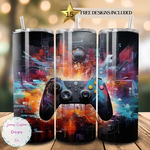 May include: A colorful abstract design with a video game controller in the center. The design is on a stainless steel tumbler with a straw. The tumbler is 20 ounces.