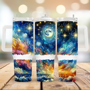May include: Three stainless steel tumblers with a handle. Each tumbler features a different abstract painting of a starry night sky with a moon and stars. The painting is in shades of blue, yellow, orange, and white.