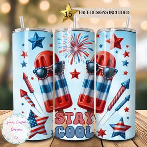 May include: A set of three 20 oz stainless steel tumblers with a patriotic theme. The tumblers feature red, white, and blue popsicles with sunglasses, fireworks, and stars. The middle tumbler has the text "Stay Cool" in large, bold letters.