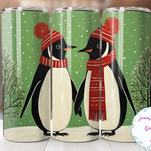 May include: Two penguins wearing red knit hats and scarves stand on a green background with white snowflakes. The penguins are facing each other and appear to be holding hands. The background is a snowy green landscape with a small tree on each side.