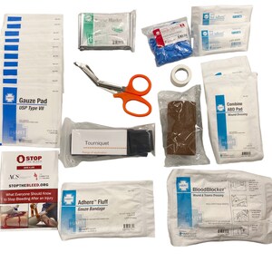 May include: A first aid kit with a variety of supplies, including gauze pads, bandages, a tourniquet, scissors, and gloves. The kit also includes a small pamphlet with instructions on how to stop bleeding.