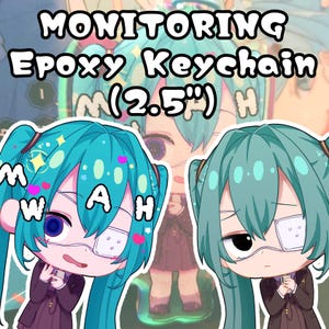 May include: Epoxy keychain featuring a cartoon character with teal hair and an eye patch. The keychain is approximately 2.5 inches in size. The text "MONITORING Epoxy Keychain M (2.5") H" is displayed at the top of the image.
