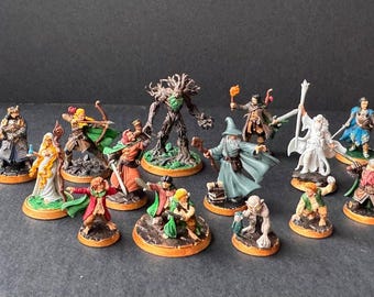 May include: A collection of 14 painted miniature figures, including a tree, a wizard, a warrior, and a knight. The figures are on circular bases and are ready for tabletop gaming.