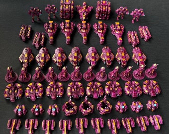 May include: A collection of miniature spaceships painted in shades of purple and pink. The spaceships are arranged in rows and include various designs, such as fighter jets, bombers, and cruisers.