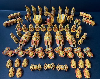 May include: A collection of gold and orange painted miniature figures, including spaceships, robots, and other sci-fi themed objects.