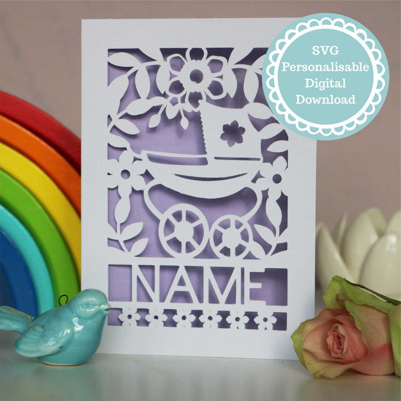 A personalised new baby card SVG with a vintage pram and floral border and baby's name