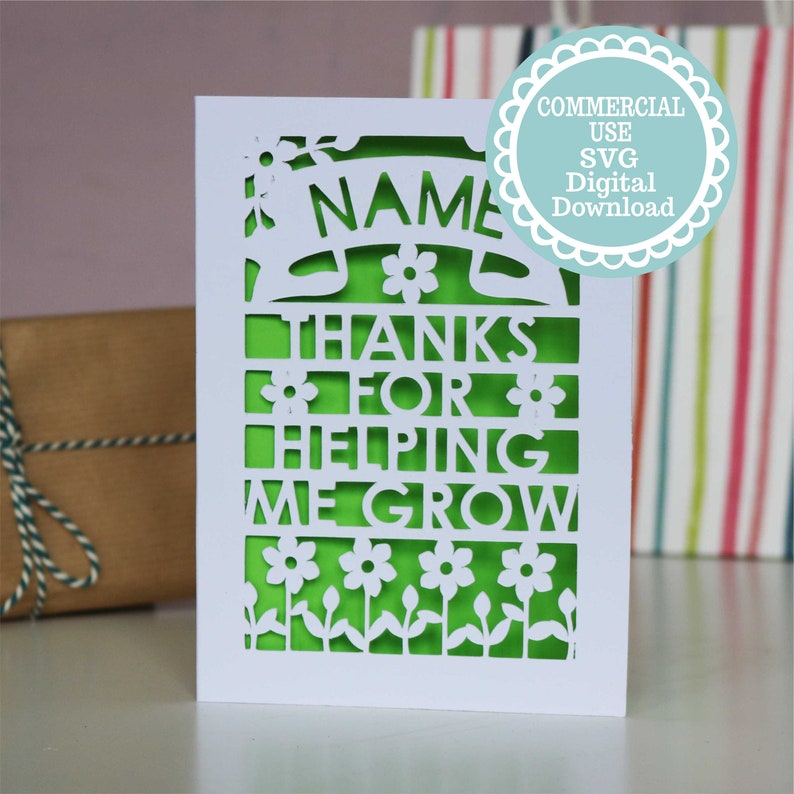 May include: White card with a green cut-out design. The design features flowers, leaves, and the text "NAME THANKS FOR HELPING ME GROW".