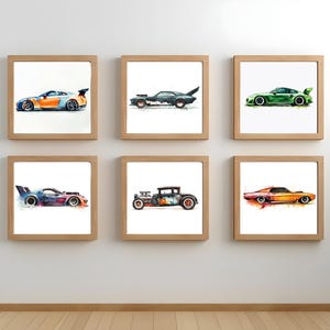 May include: Six framed watercolour prints of race cars in various colours, including orange, blue, green, and black. Each car has a unique design and is set against a white background. The frames are made of light-coloured wood.