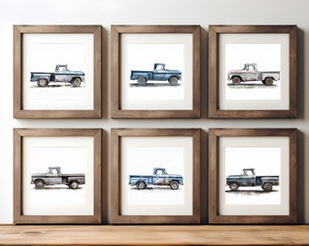 May include: Six framed watercolor paintings of vintage blue pickup trucks. Each truck is depicted in a slightly different shade of blue and has a weathered, rustic look.