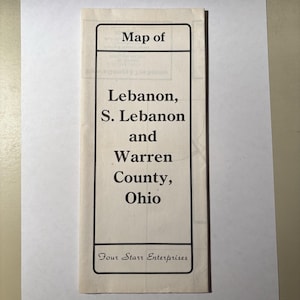 May include: A rectangular paper map featuring black text on a cream background. The cover reads Map of Lebanon, S. Lebanon and Warren County, Ohio, with the text Four Starr Enterprises at the bottom, all enclosed within a thin black rectangular border.