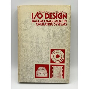 May include: A vintage book titled "I/O Design: Data Management in Operating Systems" by Donald E. Freeman and Olney R. Perry. The cover is beige with red text and graphics, including a square with a circle and a series of dots.