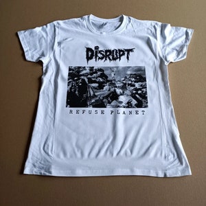 May include: White t-shirt with a black and white graphic print of a band called "DISRUPT" and the text "REFUSE PLANET".