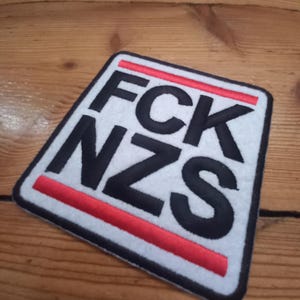 Fck Nzs, logo, embroidered patch, shaped
