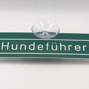Zuignapbord voor hondengeleider