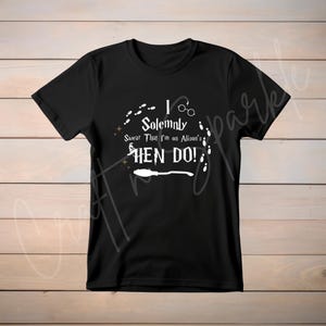 May include: Black t-shirt with white text that reads "I Solemnly Swear That I'm on Alison's Hen Do!" with a graphic of a broom, glasses, and footprints.