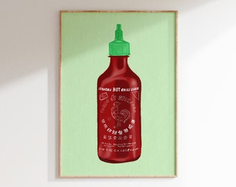 May include: A green framed print of a red hot chili sauce bottle with a green cap. The bottle has white text that reads "Sriracha Hot Chili Sauce" and a rooster illustration.