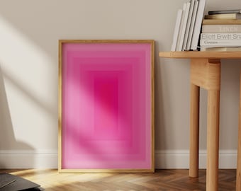 Puede incluir: Una impresión abstracta enmarcada con un diseño de degradado rosa. La impresión presenta una serie de cuadrados concéntricos en tonos de rosa, creando una estética visualmente atractiva y moderna.