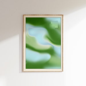 May include: A framed abstract art print with a green, blue, and white color scheme. The print features a swirling, fluid design.