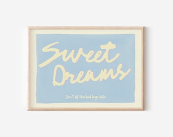 May include: A framed print with a light blue background and the words "Sweet Dreams" in yellow cursive. Below, in smaller text, it reads "Don't let the bed bugs bite."