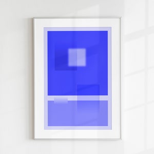 May include: A framed abstract art print with a blue background and white geometric shapes. The print is in a silver frame.