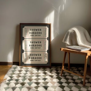 May include: A framed print of three vintage-style tickets with the text "Shower Karaoke One Entry" and the numbers "754357", "754358", and "754359".