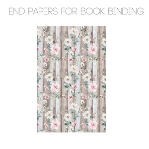 May include: A seamless pattern featuring pink and white flowers on a woodgrain background. The flowers are arranged in a repeating pattern, with the woodgrain background providing a rustic backdrop.