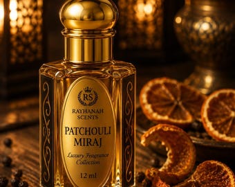 May include: A 12 ml glass perfume bottle with a gold cap and a label reading Rayhanah Scents Patchouli Miraj Luxury Fragrance Collection. The bottle has a hexagonal shape with black side panels featuring gold scrollwork and a clear liquid inside.
